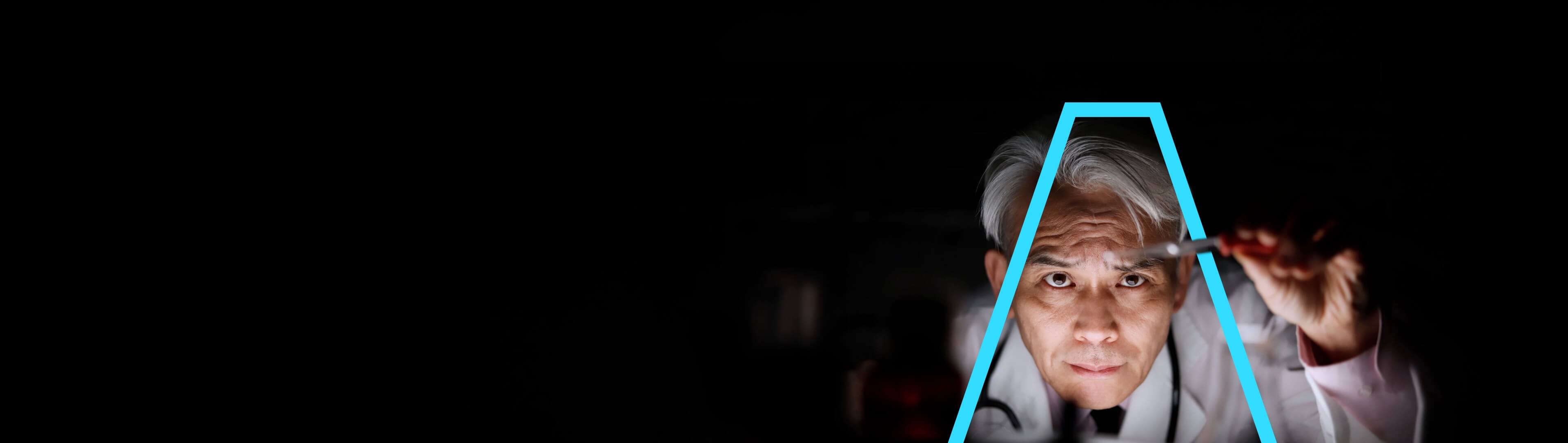 A scientist inspecting the contents of a test tube